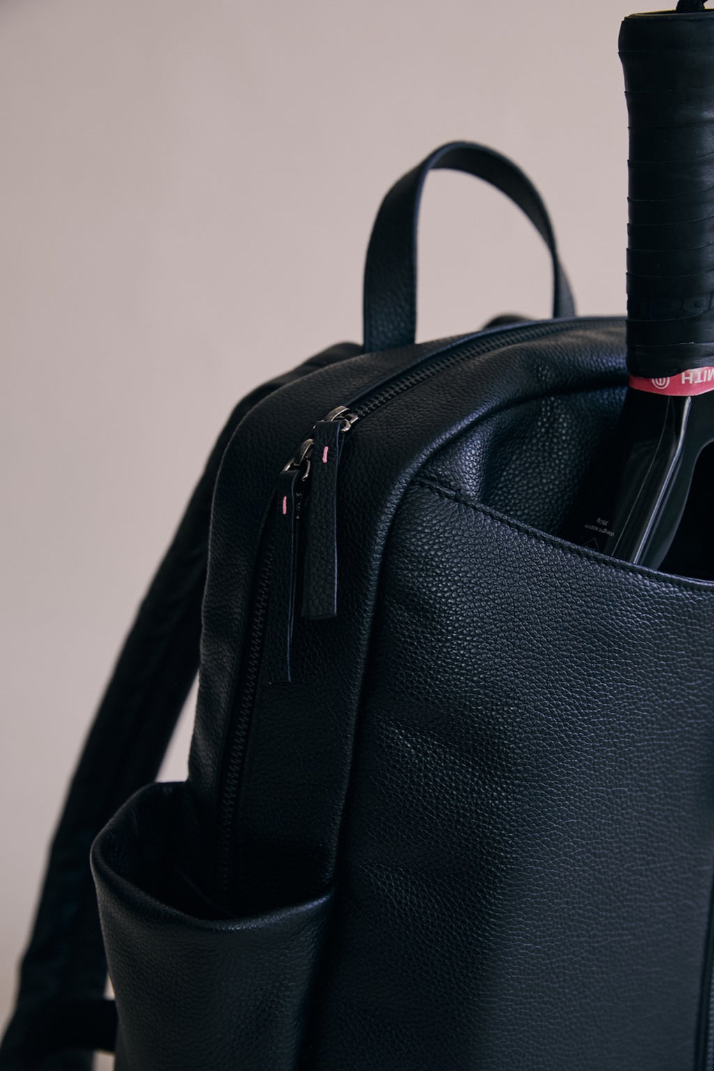 The Padelsmith Bag from the side, showing the carry handle, side pocket and racket pouch
