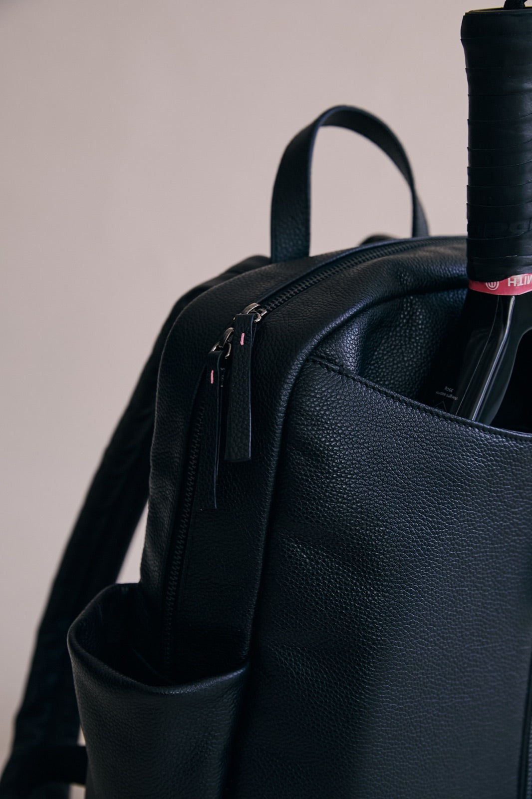 The Padelsmith Bag from the side, showing the carry handle, side pocket and racket pouch